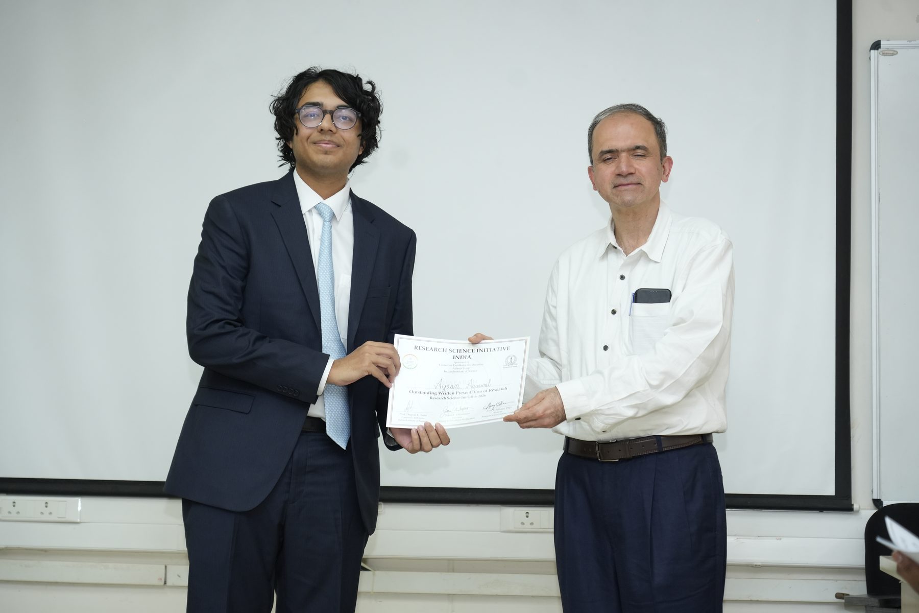 Ayaan Agarwal receiving a certificate at RSI-India